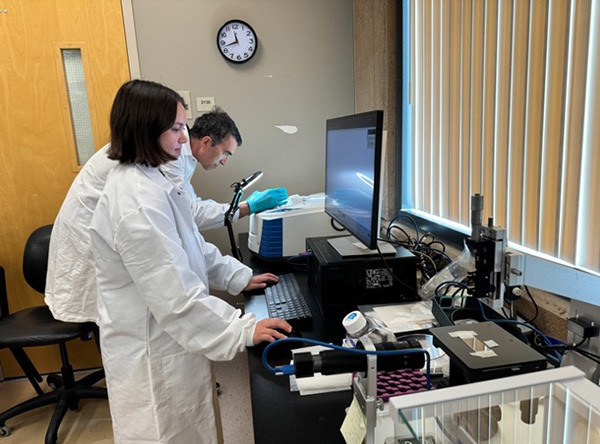 UCI senior scientist Farhad Sadeghi and biomedical engineering junior Kaylee Bear conduct polymer material characterization in the lab