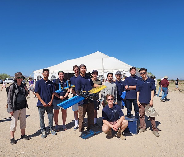 The UCI Design, Build, Fly team completed all three missions at the international competition in Arizona. Pictured, from left, are Assistant Professor Jacqueline Huynh, Rahul Donnaganti, Lucia Benjamin, Linus Fischer, Luis Zamora, Chaz Fazio, Daniel Steiner, Deepak Gupta, Chang Lee, Brandon Hrafnsson, Haoyi 