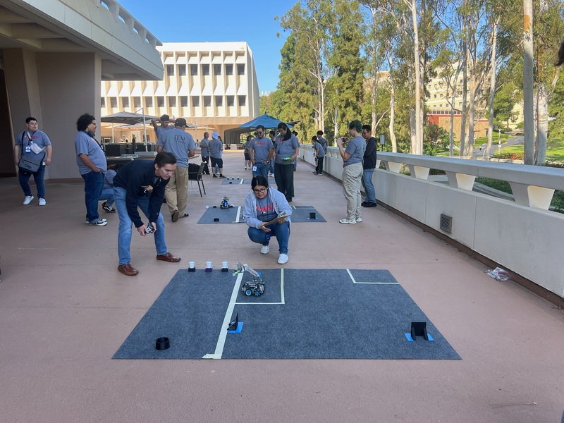 Students running their robot on the course. Students running their robot on the course.