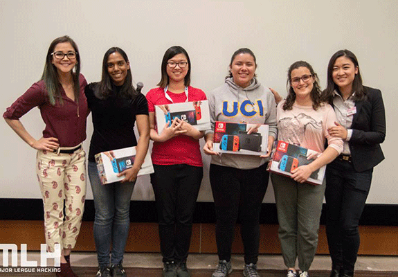 WatchDog team members hold their prizes after winning Best Big Data Hack honors. From left, Neudesic consultant Karla Benefiel; students Gunasekara, Hong, Ellington and Arabi; and Neudesic consultant Yueying Li. The Neudesic representatives were on the hackathon judging panel.