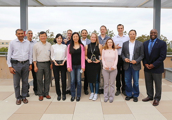 Award winners and their department chairs join the dean for a post-ceremony group photo. From left: Kumar Wickramasinghe, EECS chair; Vasan Venugopalan,  ChEMS chair; Abe Lee, BME chair; Mo Li; Joshua Dibble (accepting for Alon Gorodetsky); Sunny Jiang, CEE chair; Farzin Zareian; Jennifer Wilkens; Brian Demsky; Anna Grosberg; Zoran Nenadic; Syed Jafar; Dean Washington. Not pictured: Kerry Athanasiou. Photo: Debbie Morales.