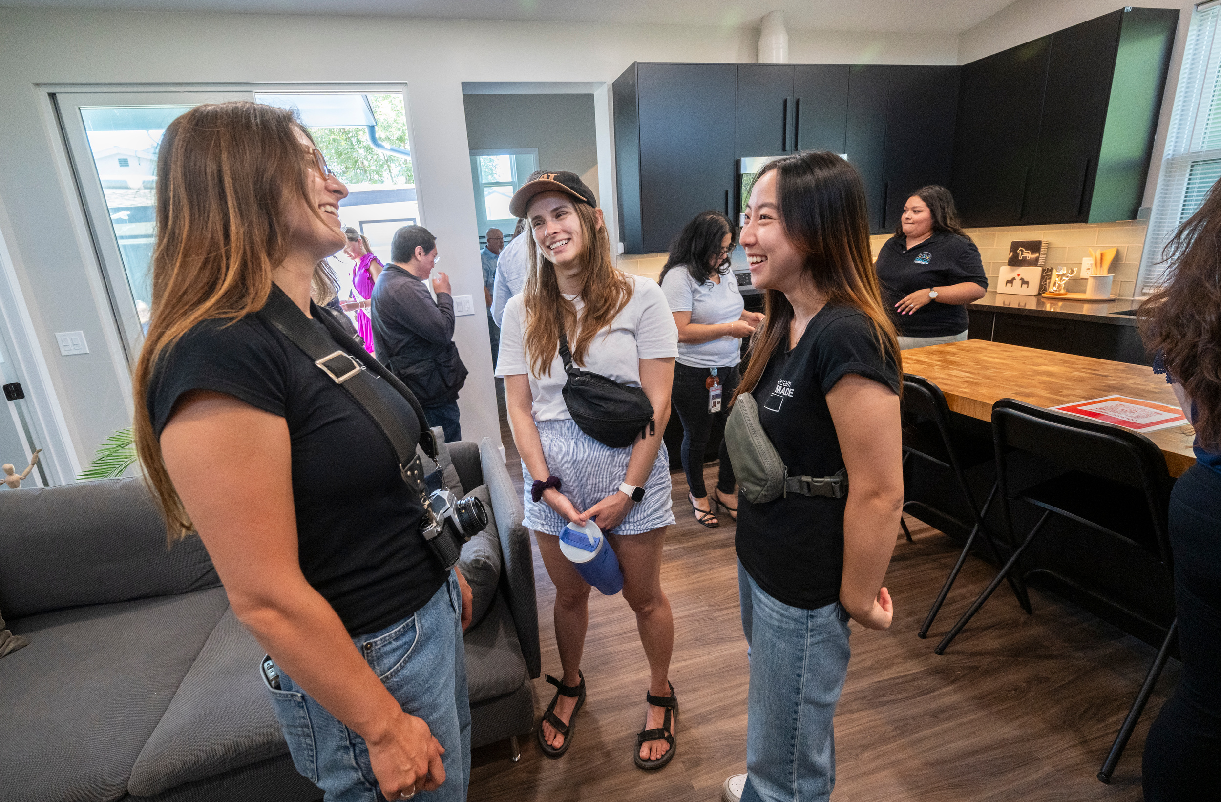 TeamMADE members from left: Georgie Ampudia, Alexandra Huff and Yuka Suzuki in the home’s living room at the opening. (Photo: Steve Zylius/UC Irvine) TeamMADE members from left: Georgie Ampudia, Alexandra Huff and Yuka Suzuki in the home’s living room at the opening. (Photo: Steve Zylius/UC Irvine)