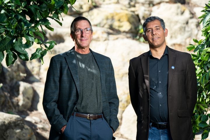Posed photo of two male researchers.
