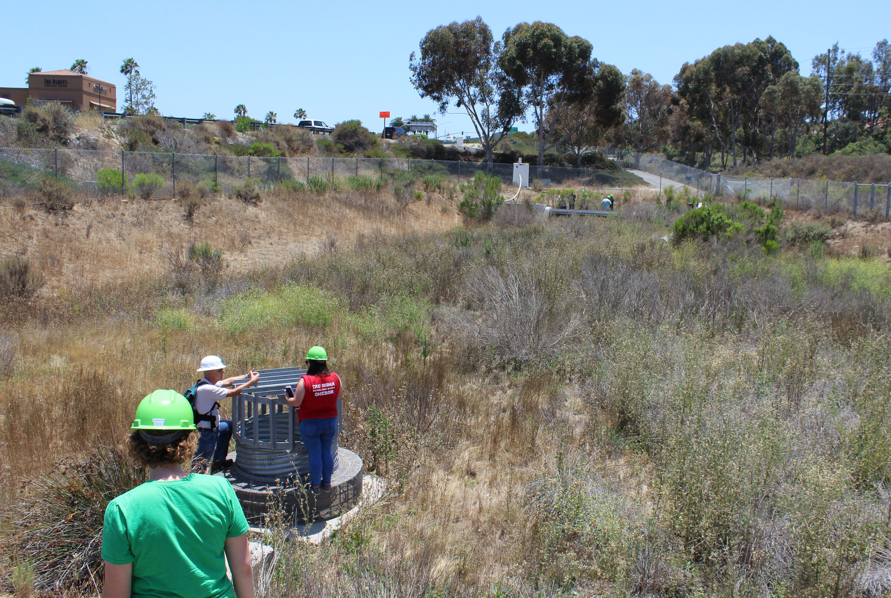 Students and workers inspect a large scale biofilter located in Irvine, CA.