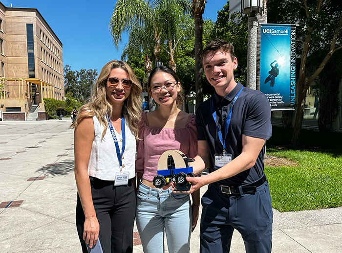 Incoming transfer students show off the remote-controlled car they created at the S-STEM Summer Bridge Program.