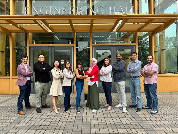 The e+Society Institute core team, shown from right to left, are Yasser Shoukry, Zhou Li, Sameer Singh, Alexandra Voloshina, Salma Elmalaki, Aparna Chandramowlishwaran, Athina Markopoulou, Yanning Shen and Hyoukjun Kwon. Strategic partners include James Owen Wetherall (shown far left) and Bill Maurer from Social Sciences, Jesse Colin Jackson from the Arts, and Stuart Matthews and Errol Arkilic from Beall Applied Innovation. 