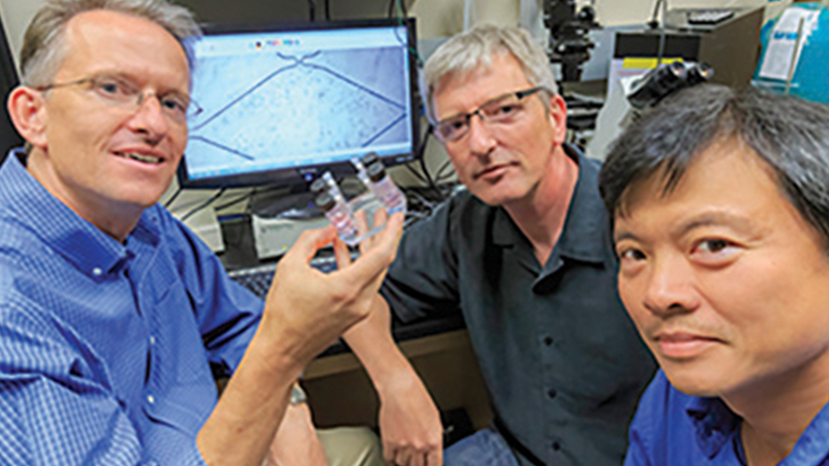 George (left), Hughes (center) and Lee (right) in the lab with their organ on-a-chip technology. Photo: Paul Kennedy