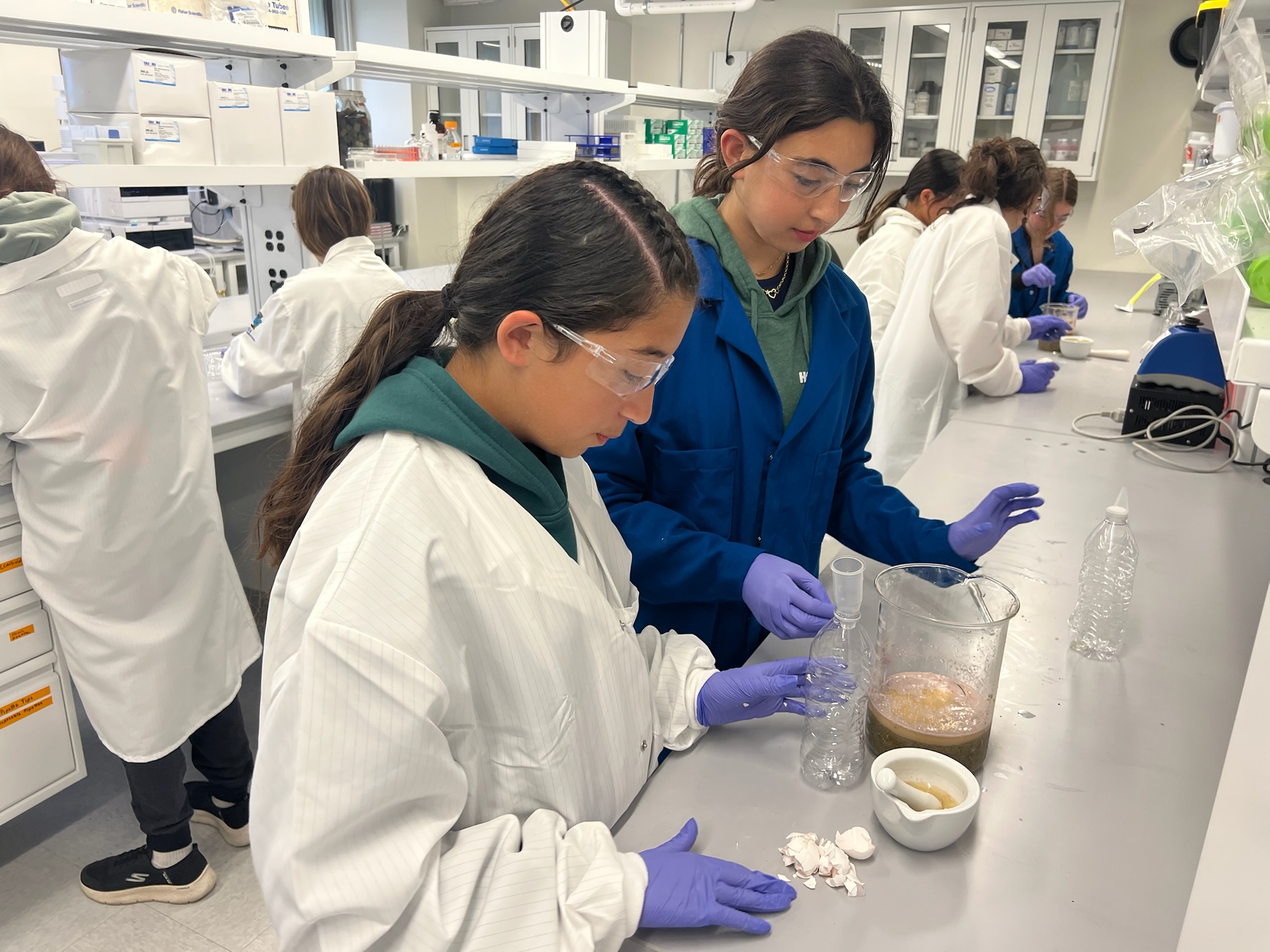 Two middle school students work together on the experiment in Hobb’s laboratory. Two middle school students work together on the experiment in Hobb’s laboratory.