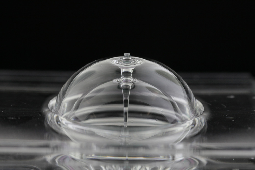 The wine glass-like structure is made of fused quartz. The wine glass-like structure is made of fused quartz.
