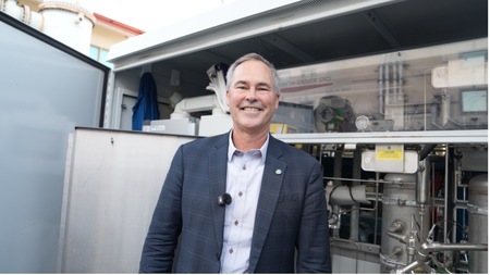 Jack Brouwer, the director of the UCI Clean Energy Institute, in front of the institute’s electrolyzer.
