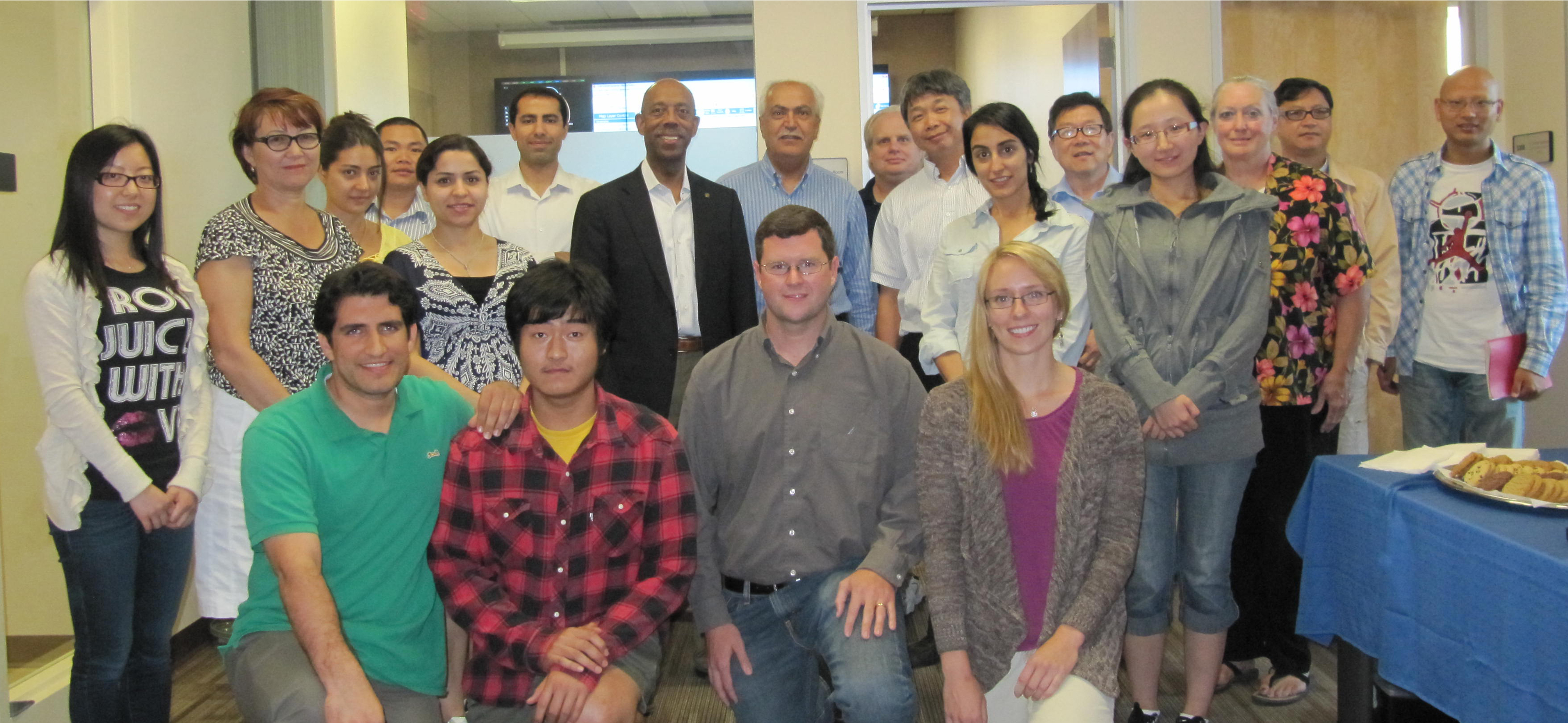 Tiantian Yang (second from bottom left) poses for a group photo with his Center for Hydrometeorology and Remote Sensing (CHRS) peers and then UC Irvine Chancellor Michael Drake in 2012. 