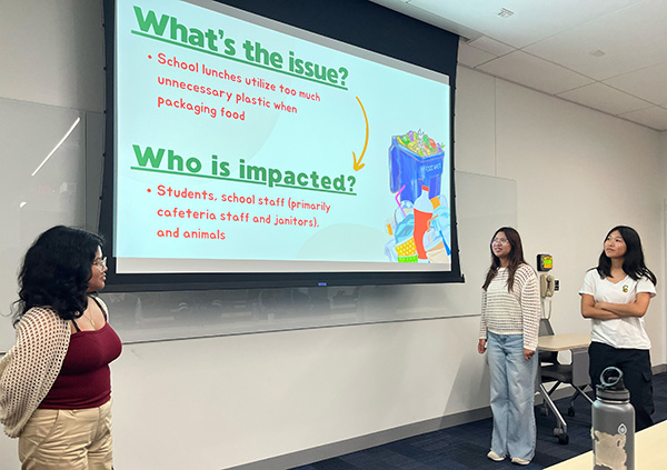  A student team presents a solution to the use of single-use plastics in the cafeteria.