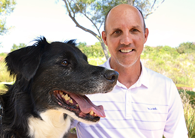 Brett Sanders with his dog Shadow