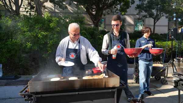 UCI Samueli School of Engineering Interim Dean Faryar Jabbari and Associate Professor David Copp serve pancakes at the Dean’s Breakfast.  