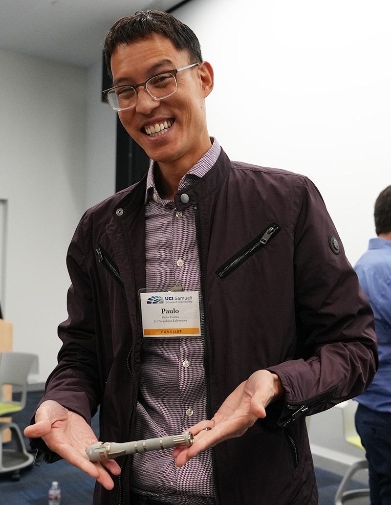 JPL/NASA Robotics Engineer Paulo Younse shows off the hermetically sealed tube he helped create for NASA’s Mars Sample Return mission.