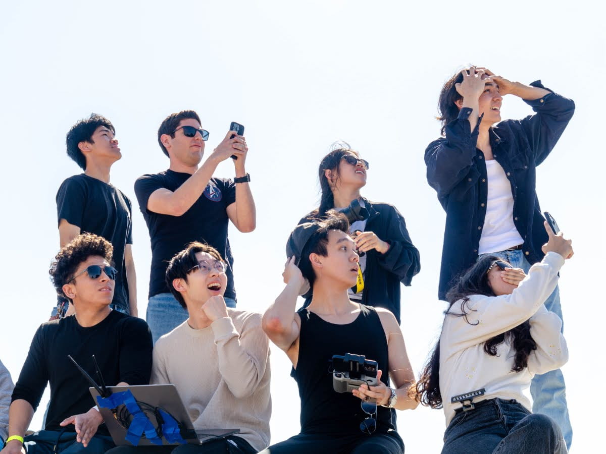 Members of the UC Irvine Rocket Project solids team react to another test launch four months later, in May 2024. Caitlyn Phan