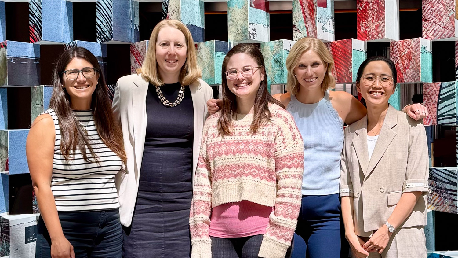 Image of five women posing for a photo